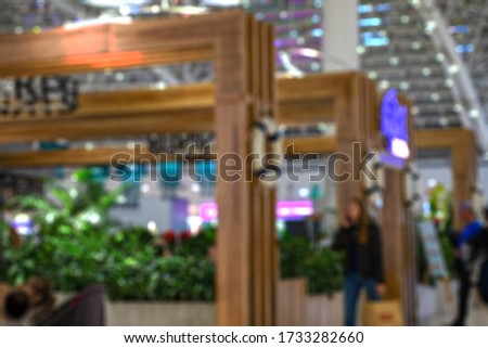 blurred image of shopping mall and people for background usage