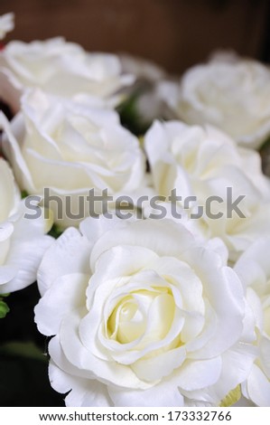 White roses showing in market fair, artificially