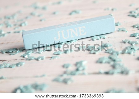 The month of June is written on a wooden bar. Background for the calendar.