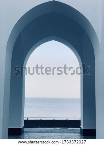 A mosque entrance with a see view