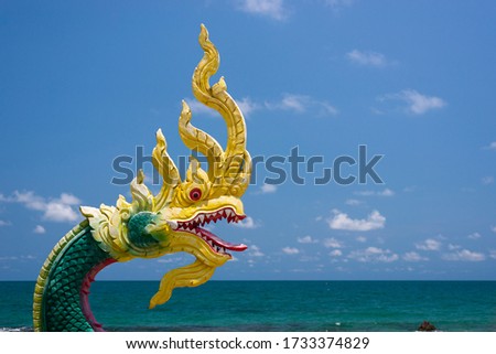 Dragon sculptures in Buddhism and sea background at Laem Mae Phim shrine Rayong, Thailand