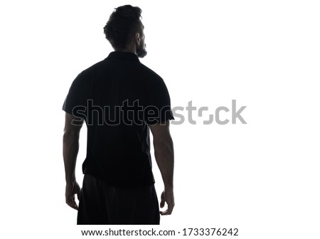 Back side silhouette of male person , back view back lit over white 