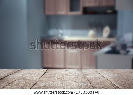 Empty wooden table in modern kitchen interior