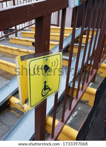 Information signs for people with disabilities near ramp on steps