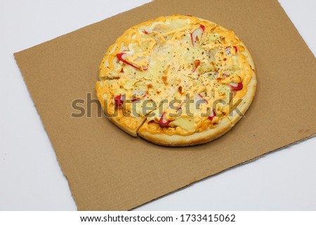 Pizza with chicken and sausage isolated on white background.
