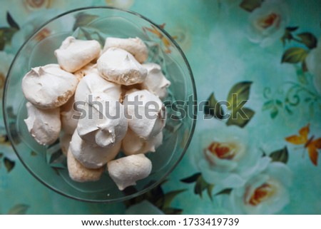 Homemade sweet bizet in the plate at the blue background with the place for your text