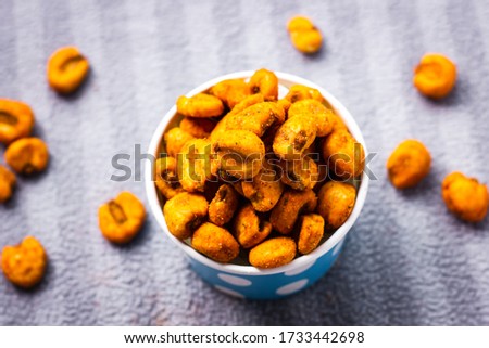 Food for though, Picture of fresh corn snacks in a tub, covered in red peppers and spices. ideal party pleaser.