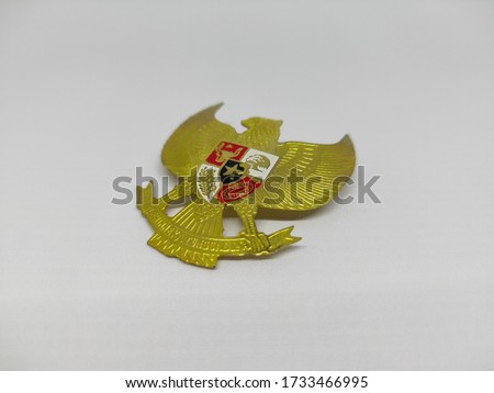 Bross Garuda Pancasila, the symbol of the Indonesian state. Isolated in white backgroud.