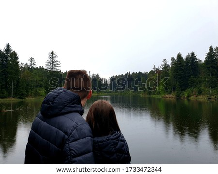 Girl and boy at the lake