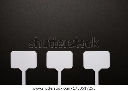 mockup for price tags, labels. Three white nameplates on a black background