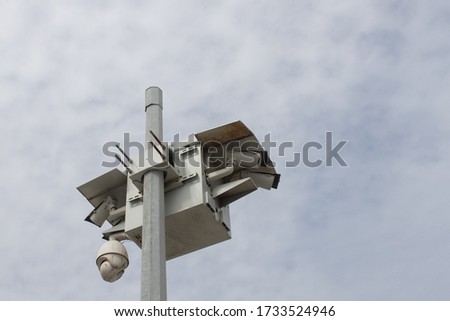 A low angle shot of street surveillance cameras - security concept