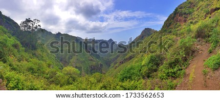 This picture shows the calm view from a mountain path on a canyon between the stunning exotic mountains.