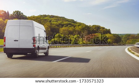 fast vans traveling on the highway Royalty-Free Stock Photo #1733571323