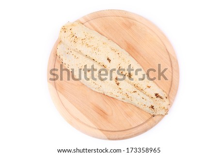 Fresh grilled fillet of pangasius. Isolated on a white background.