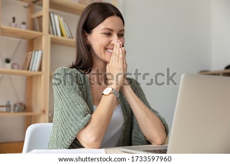Close up happy excited businesswoman puts hands in prayer, thanking fate for business success. Smiling female employee celebrating great work results. Student received good news, positive exam result Royalty-Free Stock Photo #1733597960