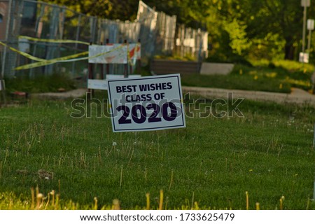 A single sign that reads 'Best Wishes Class of 2020'. The sign was placed outside the Mt Pulaski, IL high school to acknowledge the graduating seniors that will be graduating virtually.  