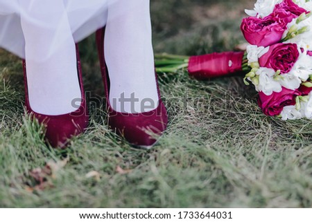 Burgundy shoes, wedding dress, bridal wedding bouquet