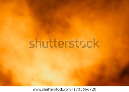 Colorful and realistic orange smoke background