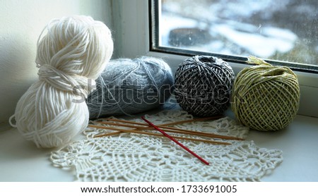 threads for knitting and knitting needles on different backgrounds photo for micro-stock