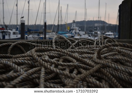 Closeup photograph of nautical rope on the harbour in Scarborough, Yorkshire, England.