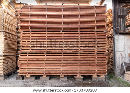 Pile / stack of sawn / chopped wood. Pictures of the timber or wood industry