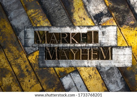 Photo of real authentic typeset letters forming Market Mayhem text on vintage textured grunge copper background