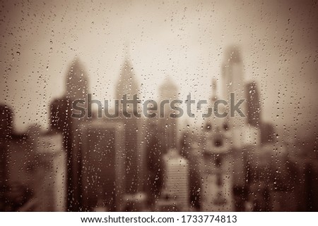 Philadelphia city rooftop view with urban skyscrapers in a raining day.