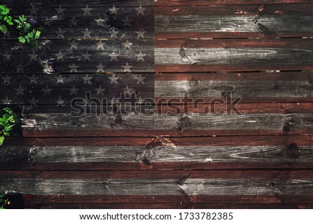 USA flag on old wooden background. Timber texture. Vintage wallpaper