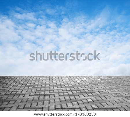 paving stone floor with cloud and blue sky