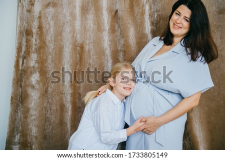 happy caucasian mother hugs with her child
