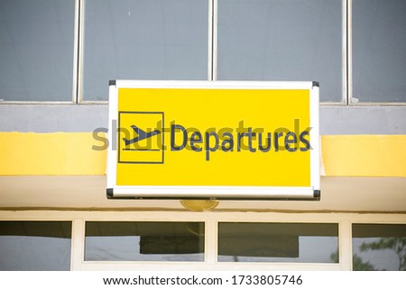 a departure sign at an airport