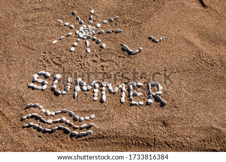 Summer picture from pebble and sand on a beach. Summer background