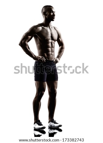 one young african muscular build man standing topless silhouette  isolated on white background
