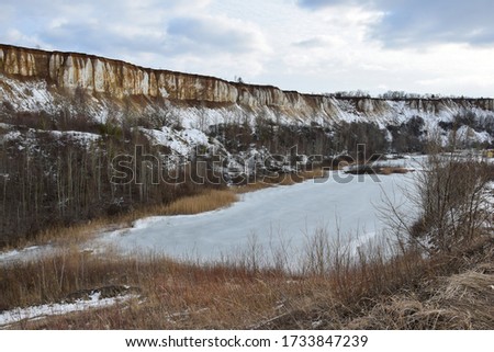 Winter landscape with a lake and chalk mountains. White well. Voronezh region. Russia