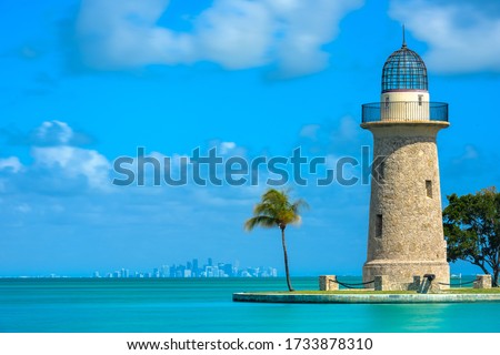 Boca Chita Lighthouse and Miami Skyline on calm day Royalty-Free Stock Photo #1733878310