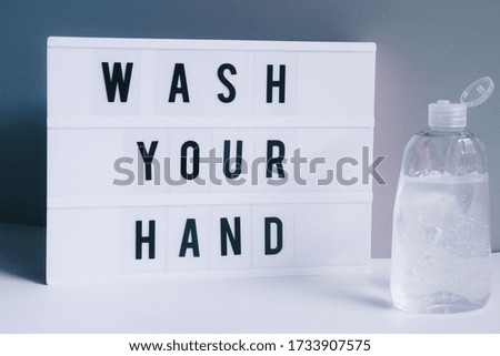 Wash your hand with disinfectant
gel, graphic image, white lightbox with text, self protecting conceptual image, flatlay composition, on a white background