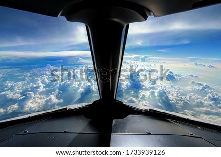 Perfect view from the cockpit, cruising Mexico with a few thunderstorms in the background. Royalty-Free Stock Photo #1733939126
