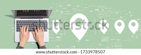 Map pin concept with person using a laptop computer