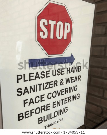 Please use hand sanitizer and wear face covering before entering building coronavirus sign at public metro park public building sanitize before entering sign poster