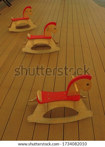 many children rocking horses for decoration and playground concept  
Retro photo effect
