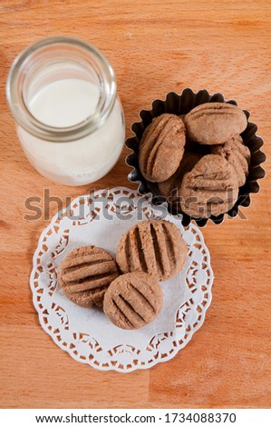 Cookies and milk on table