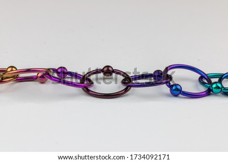Anodized titanium CBR body piercing rings Royalty-Free Stock Photo #1734092171