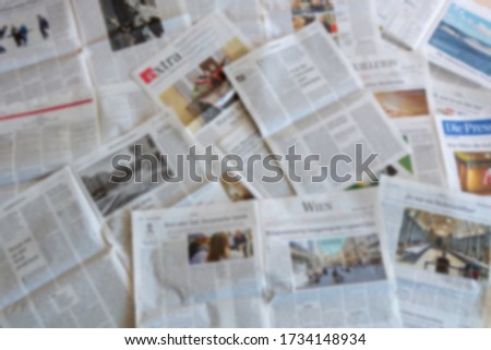 Blur image of Newspaper with text and pictures Royalty-Free Stock Photo #1734148934