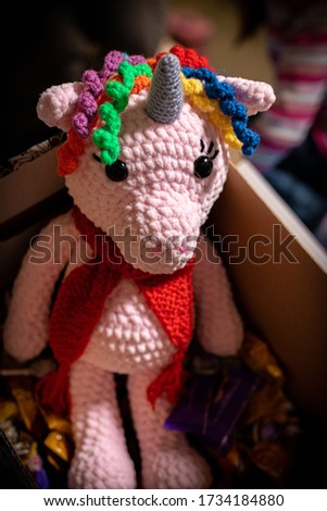 Handmade soft toy pink unicorn inside a cardboard box with painted owls.
The best gift for a girl.