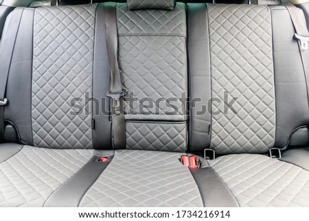 Car covers made of eco leather. An article about the upholstery of seats in a car. Premium cases. Premium car design. Rich car finish. Gray eco leather covers. Royalty-Free Stock Photo #1734216914