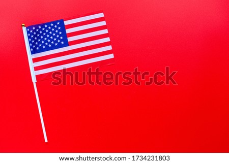 July 4th. USA flag on red background. Copy space for text. Independence Day Of America. Flat lay, top view, template