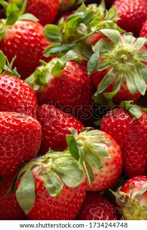 Top view of strawberries, close-up and with selective focus, vertical