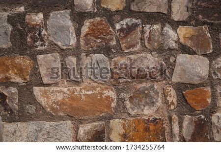 Stone wall texture background in horizontal composition.      