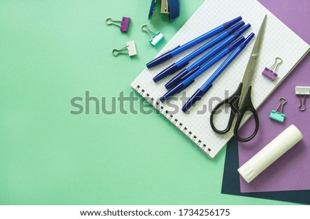 Various office stationery on a mint background