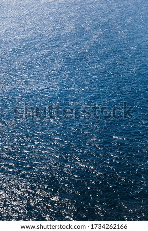 Blue ocean water surface with ripples on a sunny day